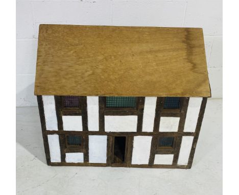 A vintage wooden dolls house