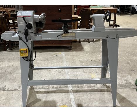 An Axminster power tools lathe and accessories 