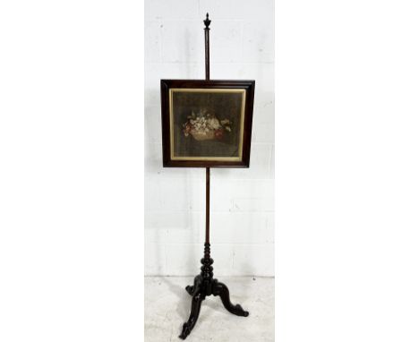An antique rosewood pole screen with tapestry panel on tripod base
