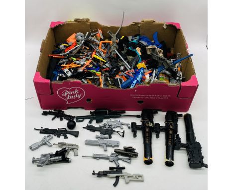 A large collection of Action Man accessories including clothing, weapons, boots, helmets etc