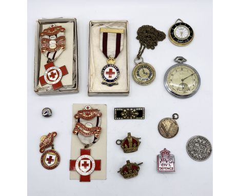 A collection of miscellaneous items including vintage Red Cross medals, Novice pocket watch, Victorian half Crown etc.