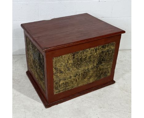 An antique Burmese manuscript chest with red lacquered finish and decorated gilt panels on three sides 