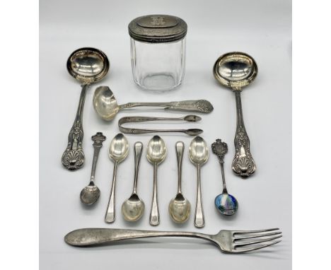 A collection of silver coffee spoons including a Rolex spoon, ladle and silver topped dressing table pot along with a pair of