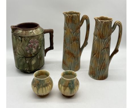 A collection of jugs and vases including a pair marked "Tulip" to base, a large Majolica jug with floral decoration and a sma