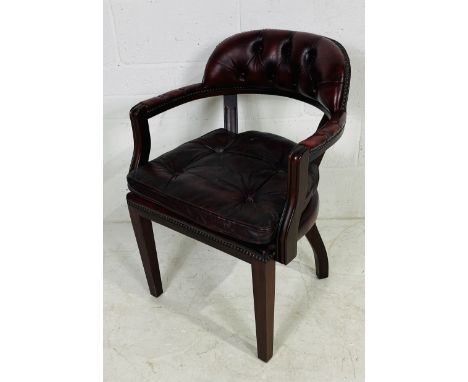 An oxblood Chesterfield office chair with button-back detailing 