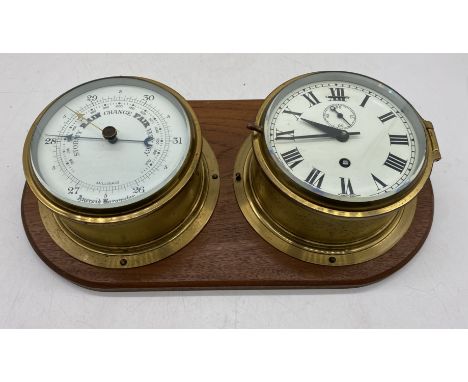 An oak mounted ships clock and aneroid barometer, each diameter 16.75cm