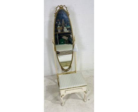 A vintage cheval mirror with gilded decoration, along with a cream painted foot stool