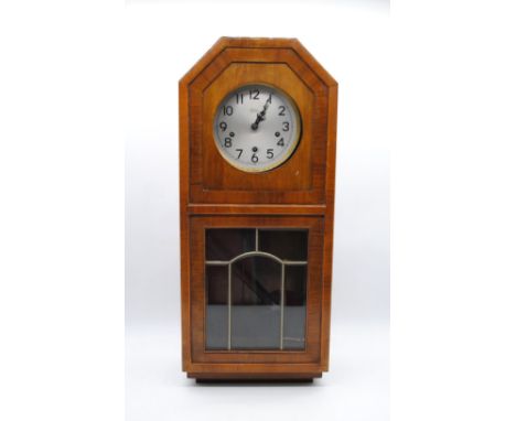 A 'Tymo' Art Deco wooden wall clock - length 31cm, height 72.5cm