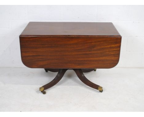 A Georgian mahogany sofa table with drawers at both ends