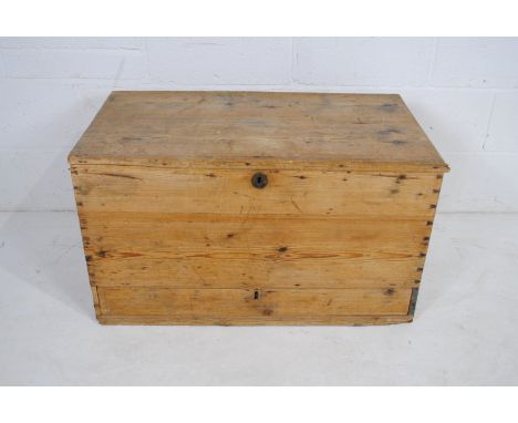 An antique pine trunk, with single drawer under - length 86cm, depth 48cm, height 49cm