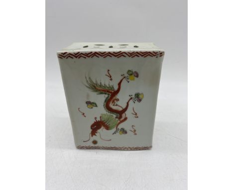 A 19th century Chinese porcelain flower brick/incense burner decorated on one side with a dragon chasing a flaming pearl ando