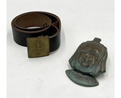 A Victorian brass door knocker in the form of Queen Victoria along with Spanish military belt 