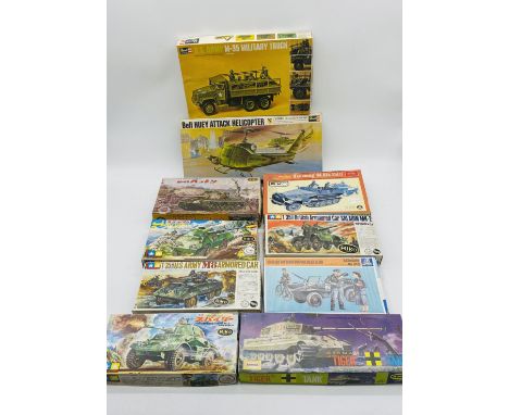 A collection of ten boxed military vehicles plastic model kits including Revell U.S Army M-35 Military Truck, Tamiya British 