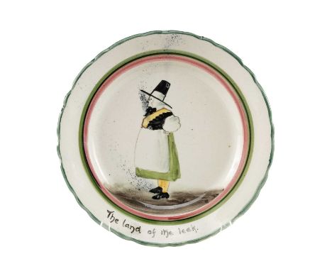 RARE LLANELLY POTTERY DISH having a wavy rim, painted to the centre with portrait of a standing lady in Welsh costume (being 