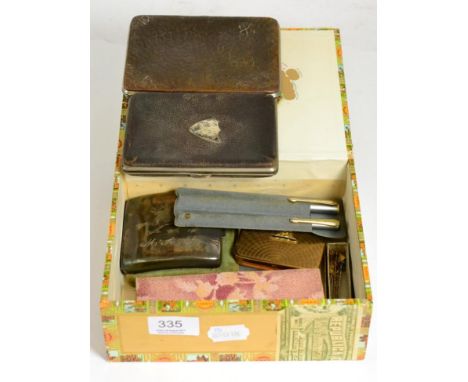 Two silver cigarette cases, two silver mounted leather wallets, Royal Artillery powder compact, Conway Stewart pen set and si