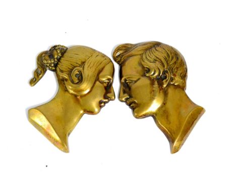 A pair of cast brass portrait plaques of Queen Victoria and Prince Albert in relief 