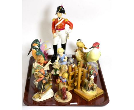 A group of Royal Worcester ceramics to include birds; military officer of the Dragoon Guards; month figure for May; Blue Ange