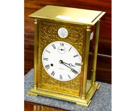 A brass modern striking mantel clock, signed Kieninger 