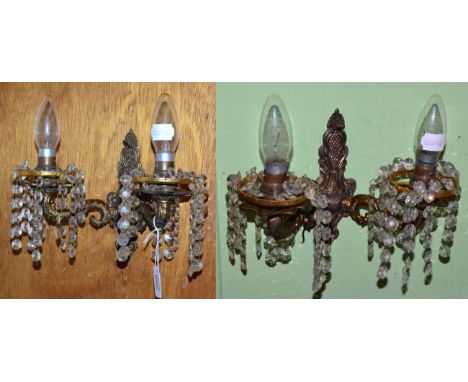A pair of twin light wall sconces with glass bead drops