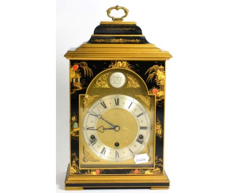 A Japanned mantle clock with a caddy top