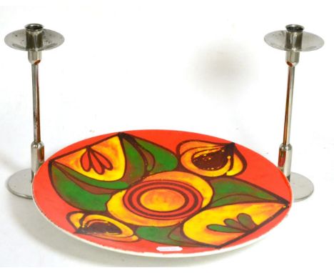 Poole pottery Delphis charger and a pair of Robert Welch candlesticks 