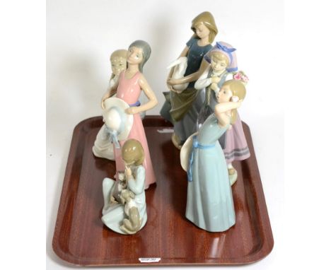 Four Lladro figures and two Nao figures 