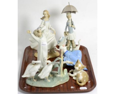Five various Lladro groups and a Nao figure