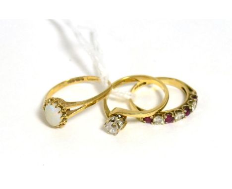 A 9ct gold ruby and diamond half hoop ring, total estimated diamond weight 0.25 carat approximately, finger size J, a 9ct gol