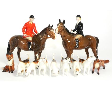 Beswick Huntsman, Standing, model No. 1501, Huntswoman, Style Two, model No. 1730, both brown gloss, two Foxes and seven Houn