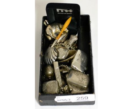 A group of silver collectables including caddy spoons, vesta cases, rattle etc