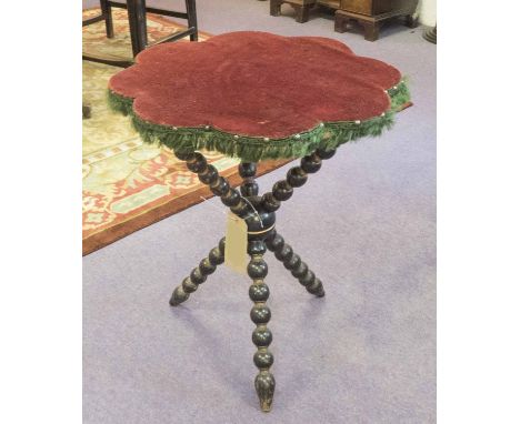 GYPSY TABLE, 19th century worn red velvet top with green silk fringe raised on ebonised and gilt bobbin supports, 62cm H x 51
