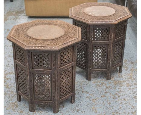 LAMP TABLES, a pair, octagonal Moorish carved hardwood and pewter inlaid and tracery bases, 53cm diam x 53cm H. (2)