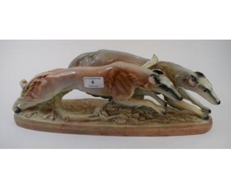 A Goldscheider (with Myott) pottery group, of two Borzoi running dogs (one leg detached but present), 45 cm wide