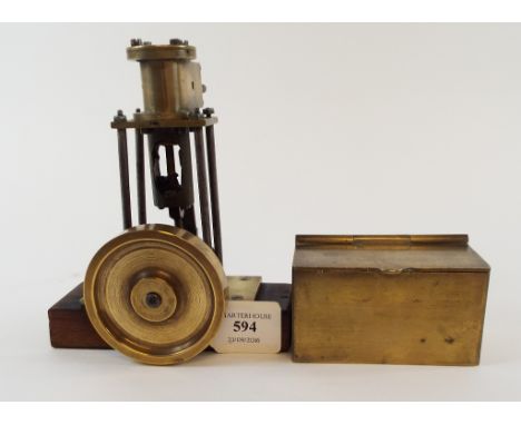 A model of a steam engine, 17 cm high, and a brass box, 10.5 cm wide