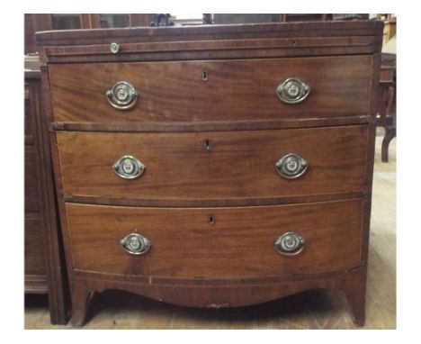 An inlaid mahogany bow front chest, with brushing slide and three long drawers, 97 cm wide