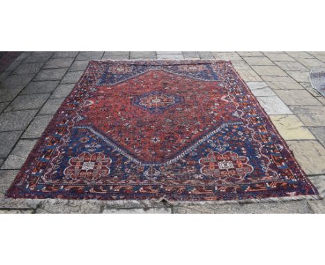 A Persian Qashqai carpet, 299 x 226 cm