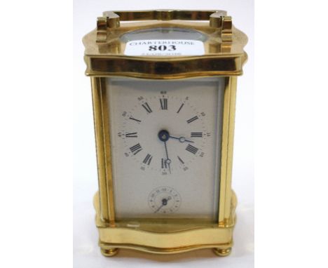 A carriage clock, with alarm, fitted a movement striking on a bell, in a four pillar case, 16 cm high (over handle) Condition