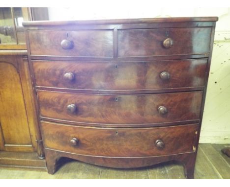 An early 19th century mahogany bow front chest, of two short and three graduated long drawers, 105 cm wide