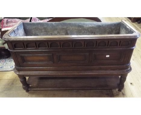 A Continental planter on stand, with a liner, 126 cm wide
