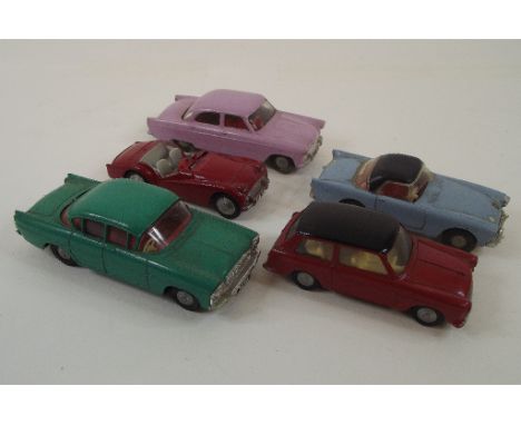 A Tri-ang Spot On Triumph TR3, and four other Spot On die-cast models, an Austin A35, a Vauxhall Cresta, a Sunbeam Alpine and