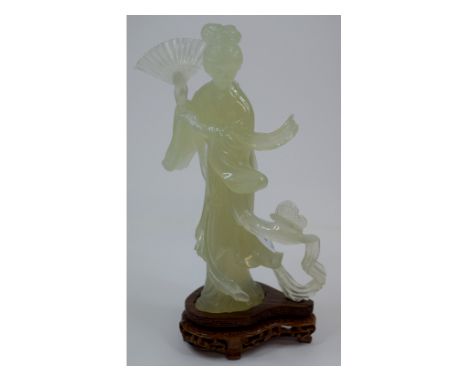 A green hardstone figure of a geisha girl, 17.5 cm high, with a pierced base, a box, and other jade style figures, all boxed 
