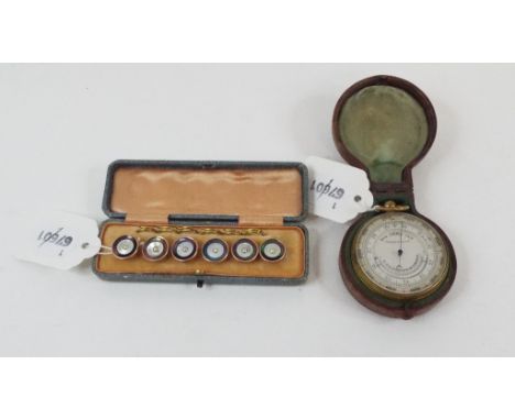 A 19th century pocket sized compensated android barometer and thermometer, 5.5 cm diameter, cased, and a set of six mother of