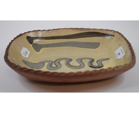 A Winchcombe pottery slipware dish, 25 cm wide