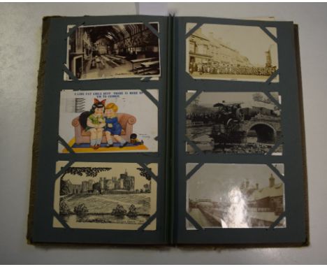 An album of postcards, including an Accident at Wooler Bridge June 18th 1908, with a traction engine having crashed into the 