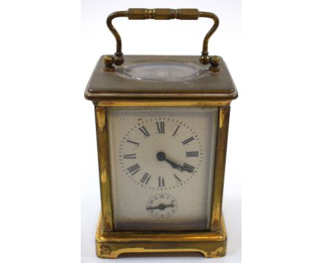 A carriage clock, with alarm, the white enamel dial with Roman numerals, fitted a movement striking on a bell, in a four pill