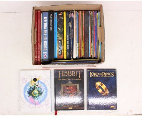Books: A collection of assorted Games Workshop, Warhammer, and Lord of the Rings books and magazines. In a read condition. Pl