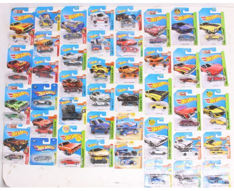 Hot Wheels: A collection of assorted Hot Wheels carded vehicles to include: Flames, Workshop, 2005 First Editions, 50 Race Te