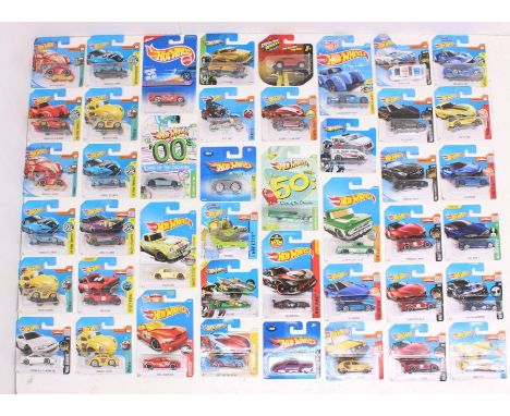 Hot Wheels: A collection of assorted Hot Wheels carded vehicles to include: Night Burnerz, Sky Show, BMW, Then and Now, Digit