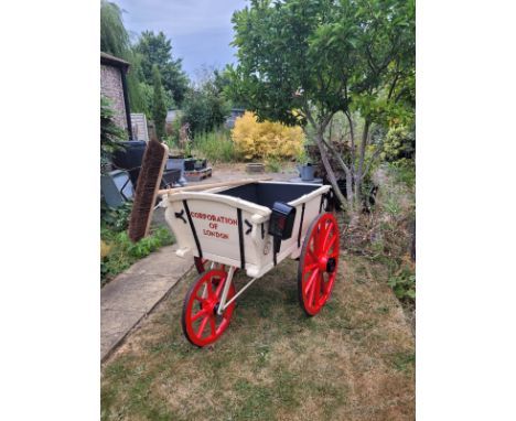 STREET ORDERLY'S HAND BARROW marked Clark of Hackney Road. Three wheeled barrow, with striking red painted wheels, body work 