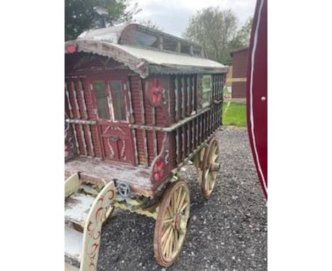 CHILD'S READING WAGON with painted bodywork in crimson on cream-painted undercarriage, pan box, steps, and iron-tyred wheels.